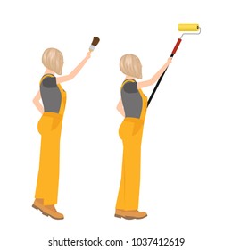 Caucasian woman builder in overalls painting the wall. Profile view