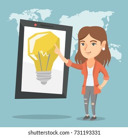 Caucasian woman pointing at a big tablet computer with a light bulb on a screen. Woman standing next to the tablet computer on the background of world map. Vector cartoon illustration. Square layout.