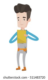 Caucasian young plumber making some notes in his clipboard. Smiling male plumber at work. Happy plumber in overalls holding clipboard. Vector flat design illustration isolated on white background.