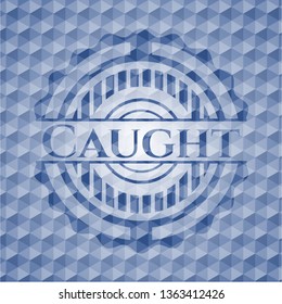 Caught blue badge with geometric pattern.