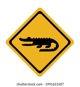 Caution crocodile warning sign.black signs on a yellow background.Be careful of animals.Isolated vector illustration on a white background.