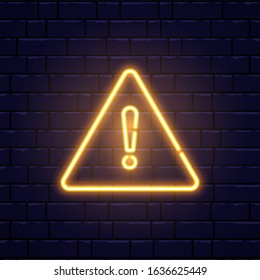 Caution neon sign on brick wall. Glowing gold exclamation mark icon. Warning symbol. Attention button. Realistic night signboard. Night bright advertising. Vector illustration