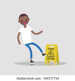 Caution, wet floor. Young black character slipped on a wet surface. Falling down. Flat editable vector illustration, clip art