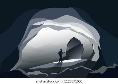 caves landscape and man standing at front cave entrance