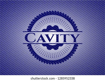 Cavity badge with denim texture