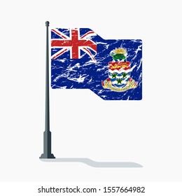 Cayman Islands flag with scratches, vector flag of Cayman Islands waving on flagpole with shadow.