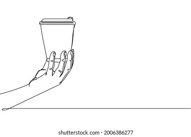 Una línea de mano continua sosteniendo una taza de café desechable en silueta sobre un fondo blanco. Linear estilizado.Minimalista.