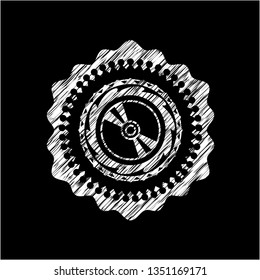 CD or disc icon drawn on blackboard