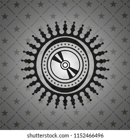 CD or DVD disc icon inside realistic black emblem