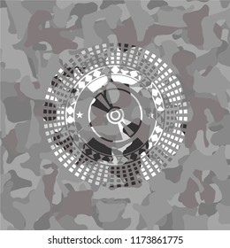 CD or DVD disc icon inside grey camo texture