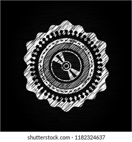 CD or DVD disc icon inside chalk emblem