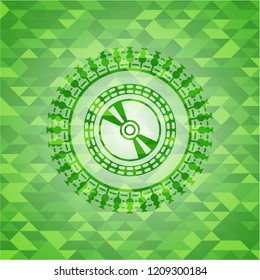 CD or DVD disc icon inside green mosaic emblem
