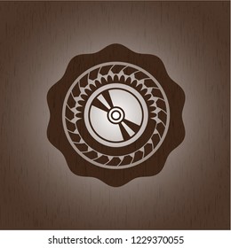 CD or DVD disc icon inside retro style wood emblem