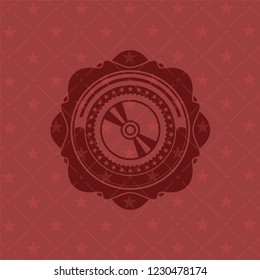 CD or DVD disc icon inside red icon or emblem