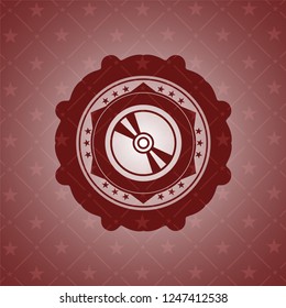 CD or DVD disc icon inside retro red emblem