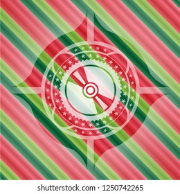 CD or DVD disc icon inside christmas emblem.