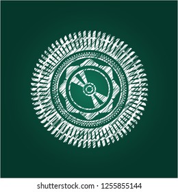 CD or DVD disc icon inside chalk emblem written on a blackboard