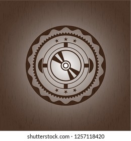 CD or DVD disc icon inside wooden emblem. Vintage.