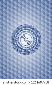 CD or DVD disc icon inside blue emblem or badge with abstract geometric pattern background.