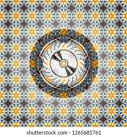 CD or DVD disc icon inside arabic style badge. Arabesque decoration.