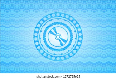CD or DVD disc icon inside water concept emblem.
