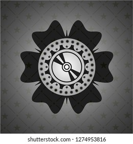 CD or DVD disc icon inside dark badge or emblem