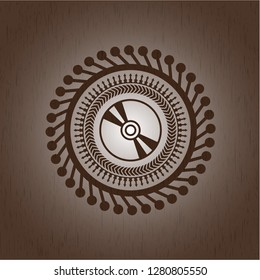 CD or DVD disc icon inside wood emblem. Vintage.
