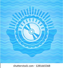 CD or DVD disc icon inside sky blue water wave badge.