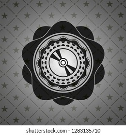 CD or DVD disc icon inside dark emblem