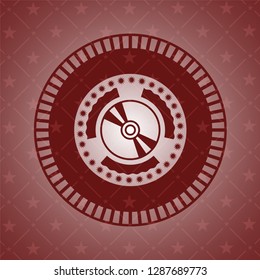 CD or DVD disc icon inside red emblem