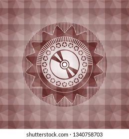 CD or DVD disc icon inside red seamless geometric badge.