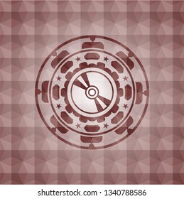 CD or DVD disc icon inside red seamless emblem or badge with abstract geometric pattern background.