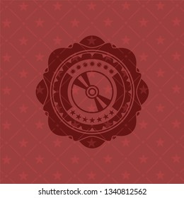 CD or DVD disc icon inside retro style red emblem
