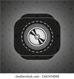CD or DVD disc icon inside black emblem