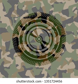CD or DVD disc icon inside camouflage texture