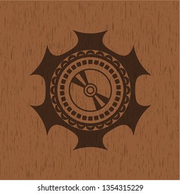 CD or DVD disc icon inside wooden emblem. Retro