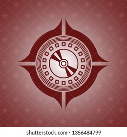 CD or DVD disc icon inside vintage red emblem