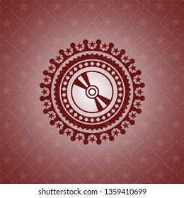 CD or DVD disc icon inside realistic red emblem