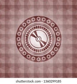 CD or DVD disc icon inside red seamless emblem with geometric background.