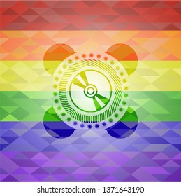 CD or DVD disc icon inside emblem on mosaic background with the colors of the LGBT flag