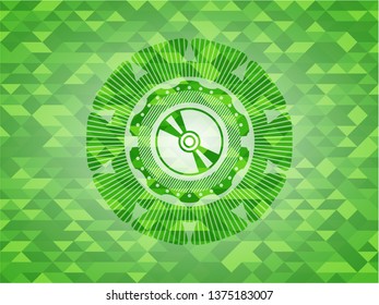 CD or DVD disc icon inside green emblem with mosaic background