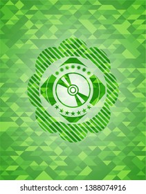 CD or DVD disc icon inside green emblem. Mosaic background