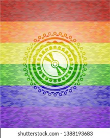 CD or DVD disc icon inside emblem on mosaic background with the colors of the LGBT flag