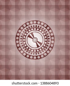 CD or DVD disc icon inside red seamless emblem with geometric background.