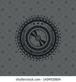 CD or DVD disc icon inside dark badge or emblem