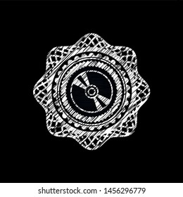 CD or DVD disc icon inside chalk emblem written on a blackboard