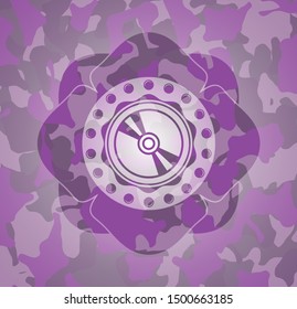 CD or DVD disc icon inside pink camouflage emblem
