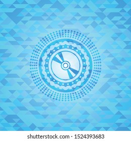CD or DVD disc icon inside realistic sky blue emblem. Mosaic background