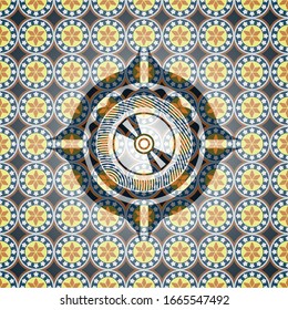 CD or DVD disc icon inside arabic emblem background. Arabesque decoration.