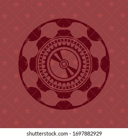 CD or DVD disc icon inside red emblem